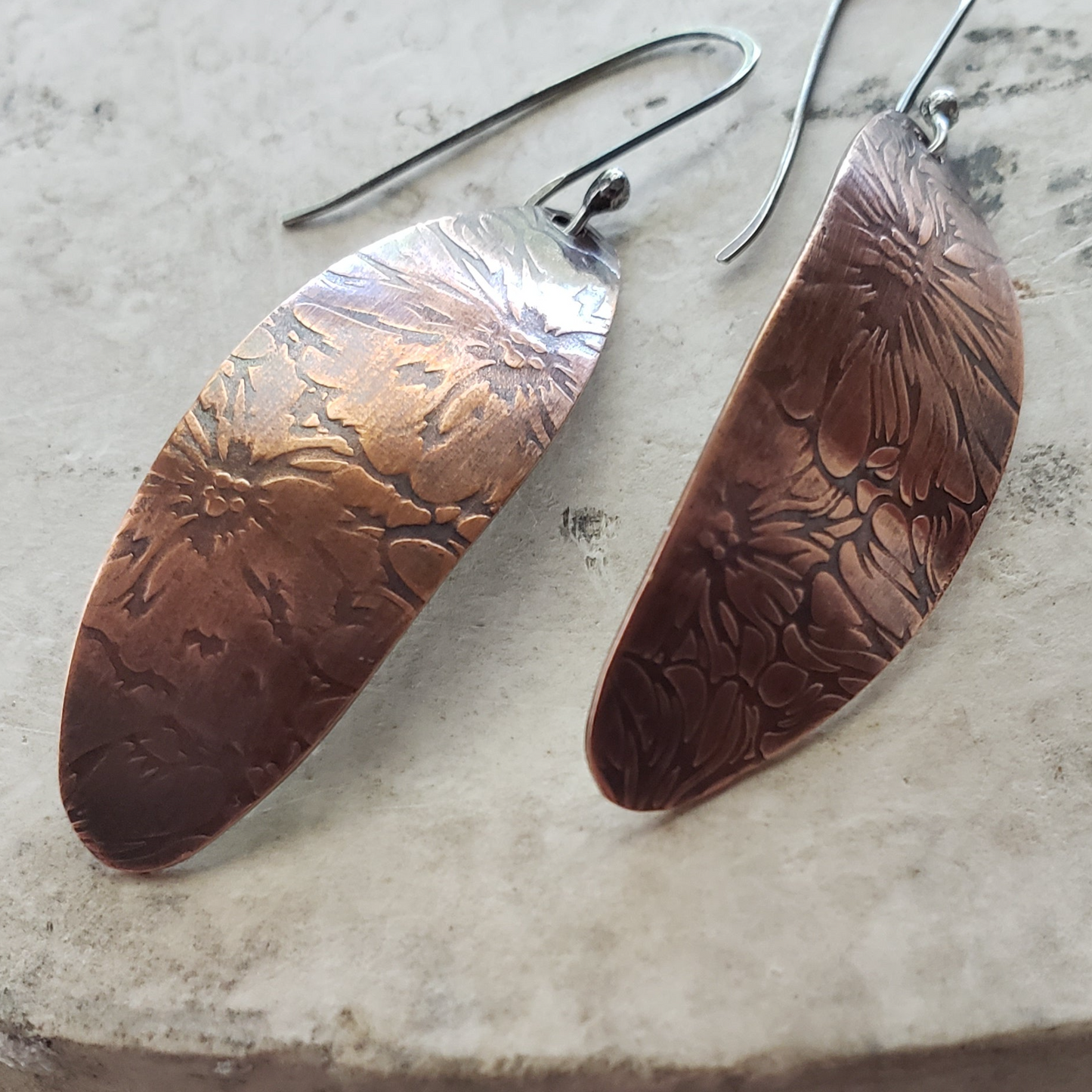 Copper dangle earrings with floral embossing